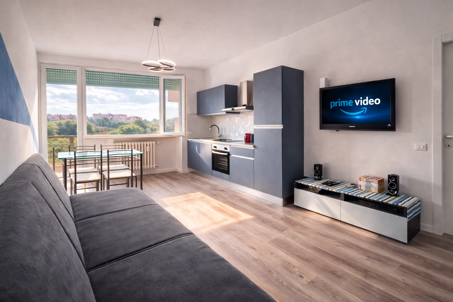 Salotto con cucina open space e Smart TV, Blue Sky Milano